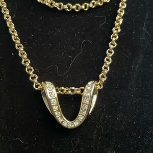 Nolan Miller gold tone and rhinestone pendant necklace